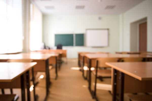 School classroom in blur background without young student.